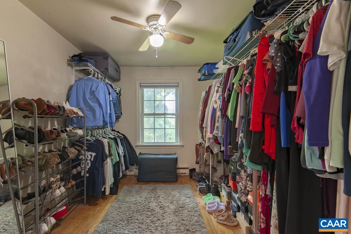 610 Bailey Road Charlottesville, VA 22903 - Photo 21 of 25 a view of walk in closet with clothes and shoes