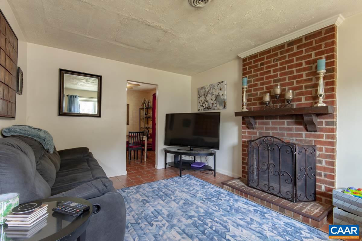610 Bailey Road Charlottesville, VA 22903 - Photo 4 of 25 a living room with furniture and a flat screen tv