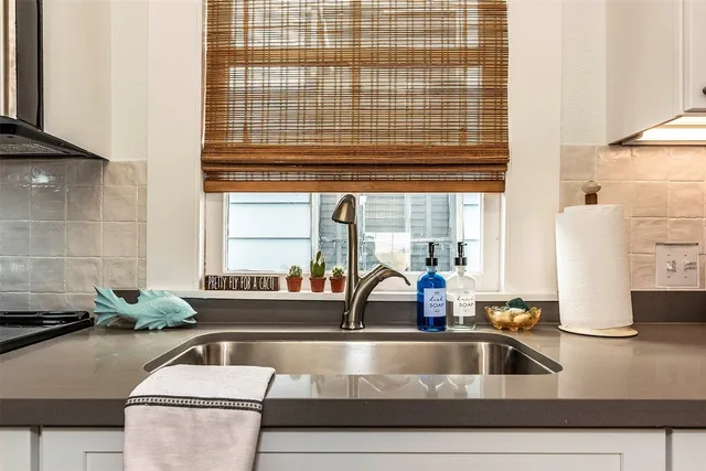 a kitchen with a sink and a window