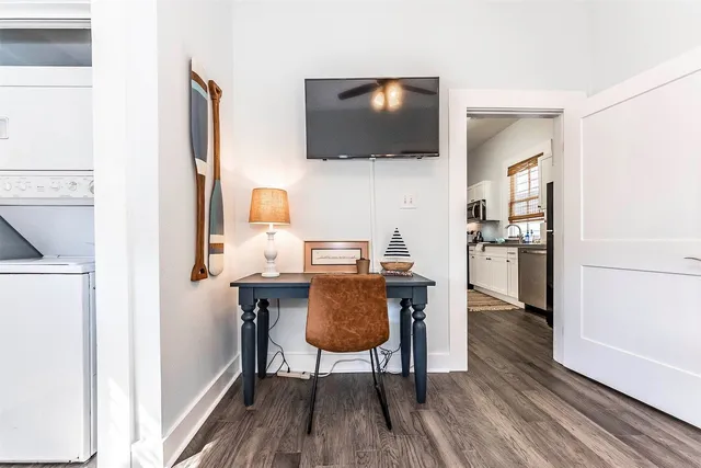 a view of a dining room with furniture and wooden floor