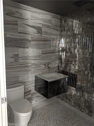 a bathroom with a sink and a toilet