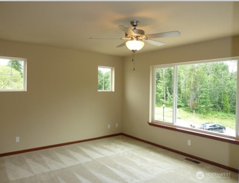 2340 Schley Boulevard Bremerton, WA 98310 - Photo 2 of 9 a view of an empty room with a window