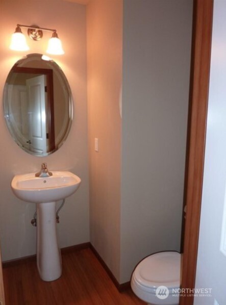 2340 Schley Boulevard Bremerton, WA 98310 - Photo 8 of 9 a bathroom with a toilet sink and mirror