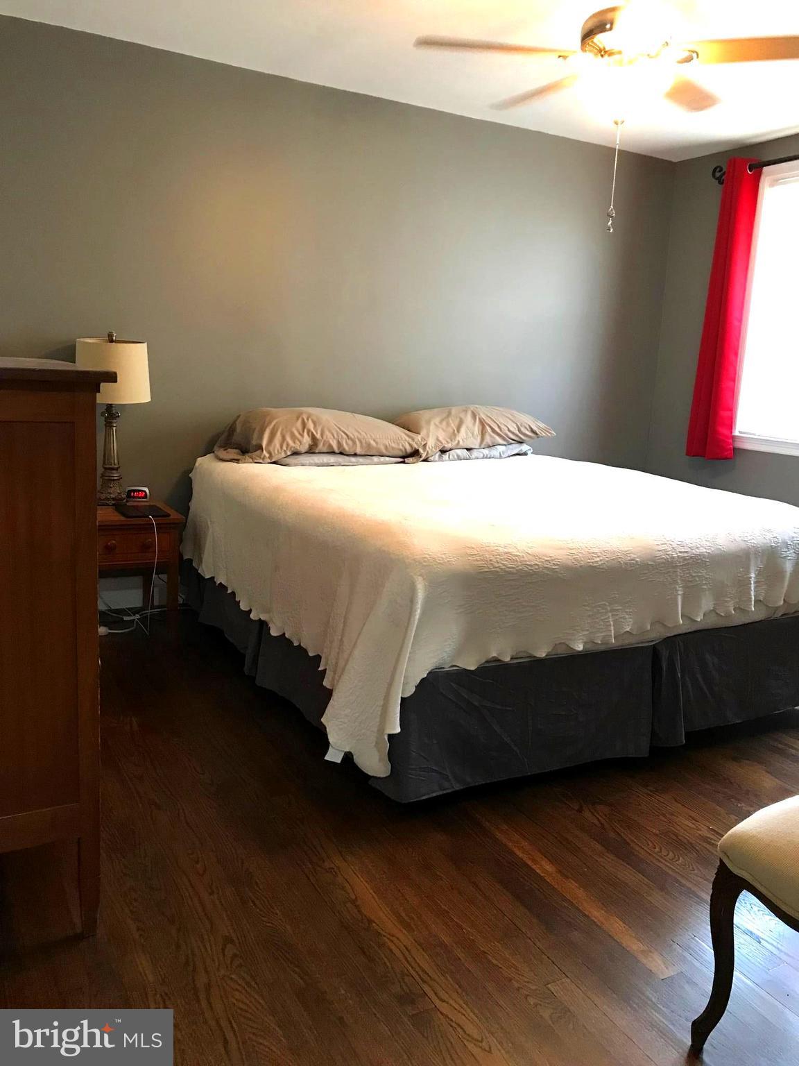 223 Westowne Road Baltimore, MD 21229 - Photo 16 of 21 a bedroom with a bed and window