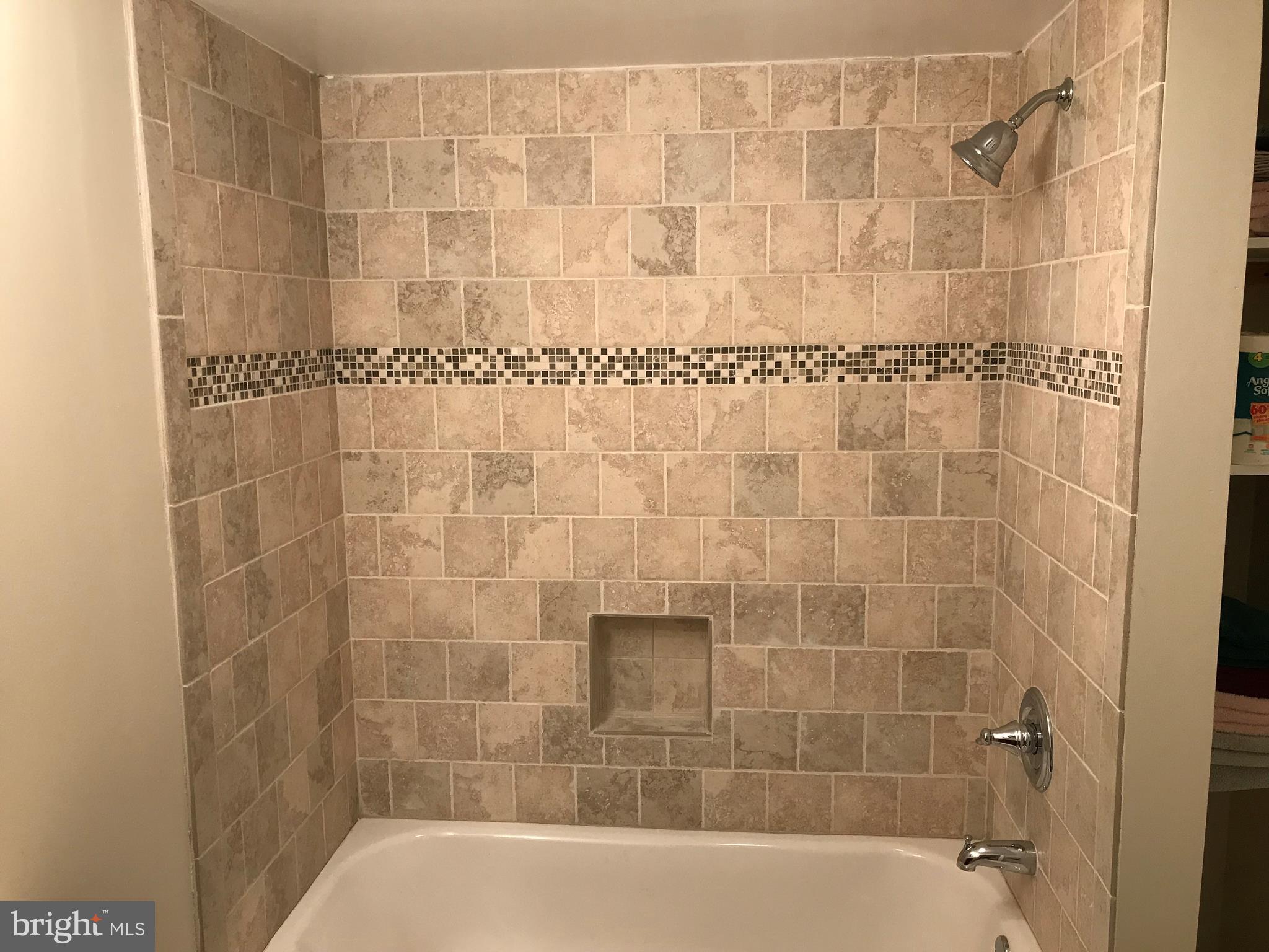 223 Westowne Road Baltimore, MD 21229 - Photo 17 of 21 a bath tub sitting next to a shower