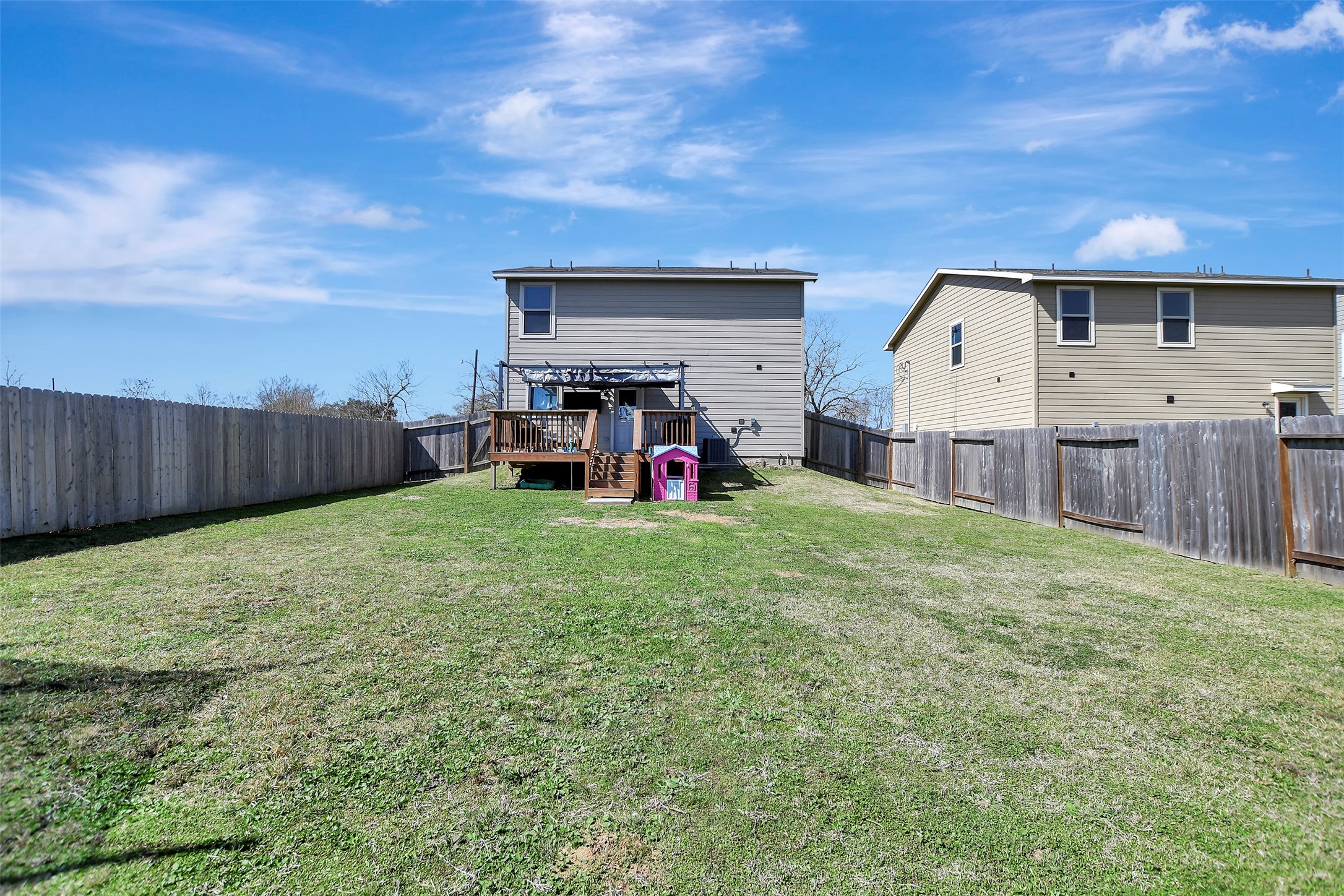 950 21st Street Hempstead, TX 77445 - Photo 35 of 35 Privacy-fenced backyard situated on the first of two lots, offering secure space for pets, play, or outdoor enjoyment.