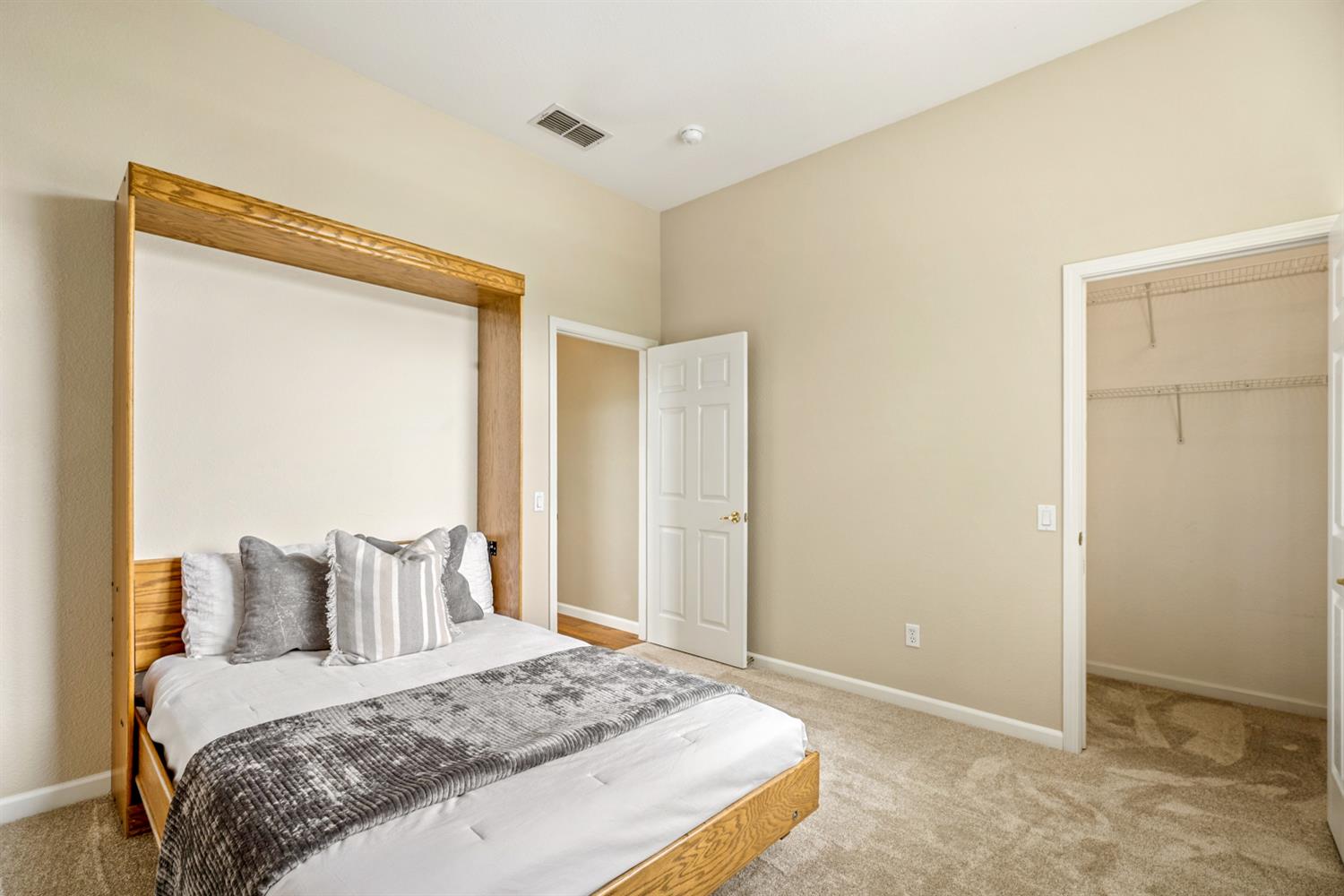 4081 Rose Creek Road Roseville, CA 95747 - Photo 35 of 52 a bedroom with a bed and wooden floor
