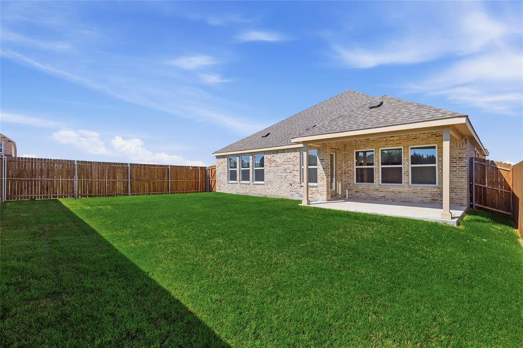 2529 Rivers W Road Anna, TX 75409 - Photo 33 of 40 Expansive green lawn with a full privacy fence
