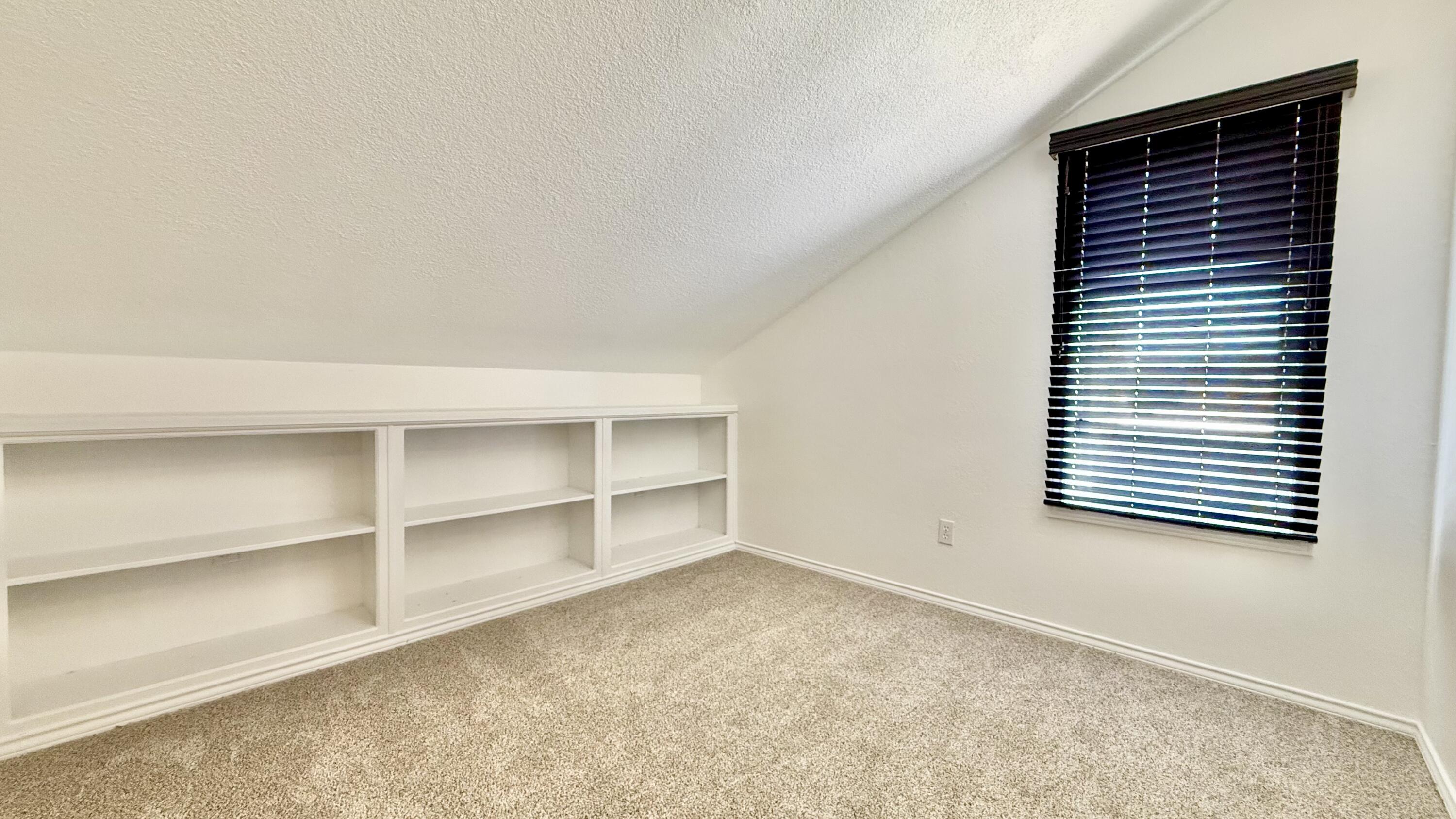 502 North Homestead Avenue Lubbock, TX 79416 - Photo 20 of 33 a view of an empty room with a window