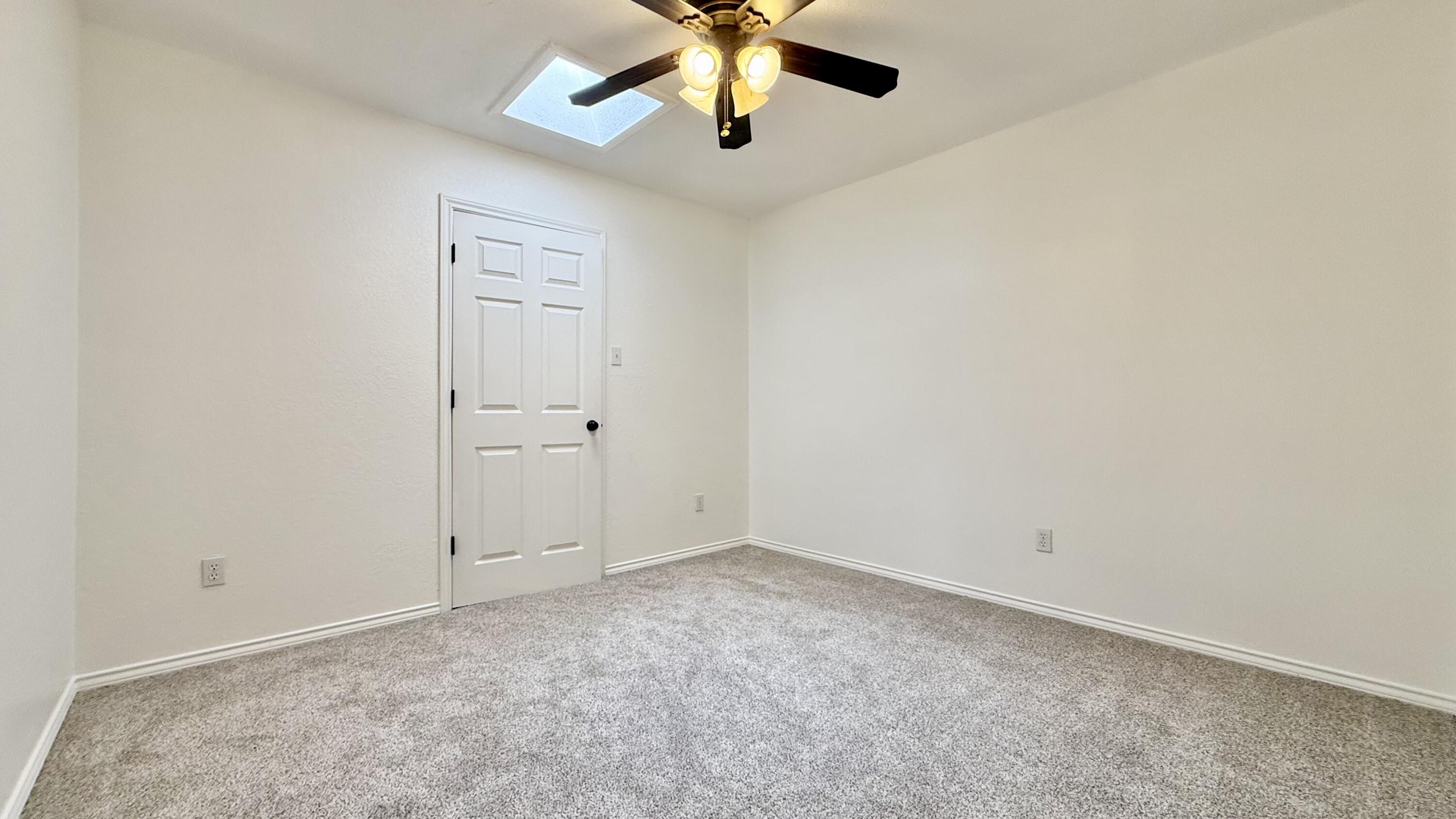 502 North Homestead Avenue Lubbock, TX 79416 - Photo 28 of 33 an empty room with closet and a chandelier fan