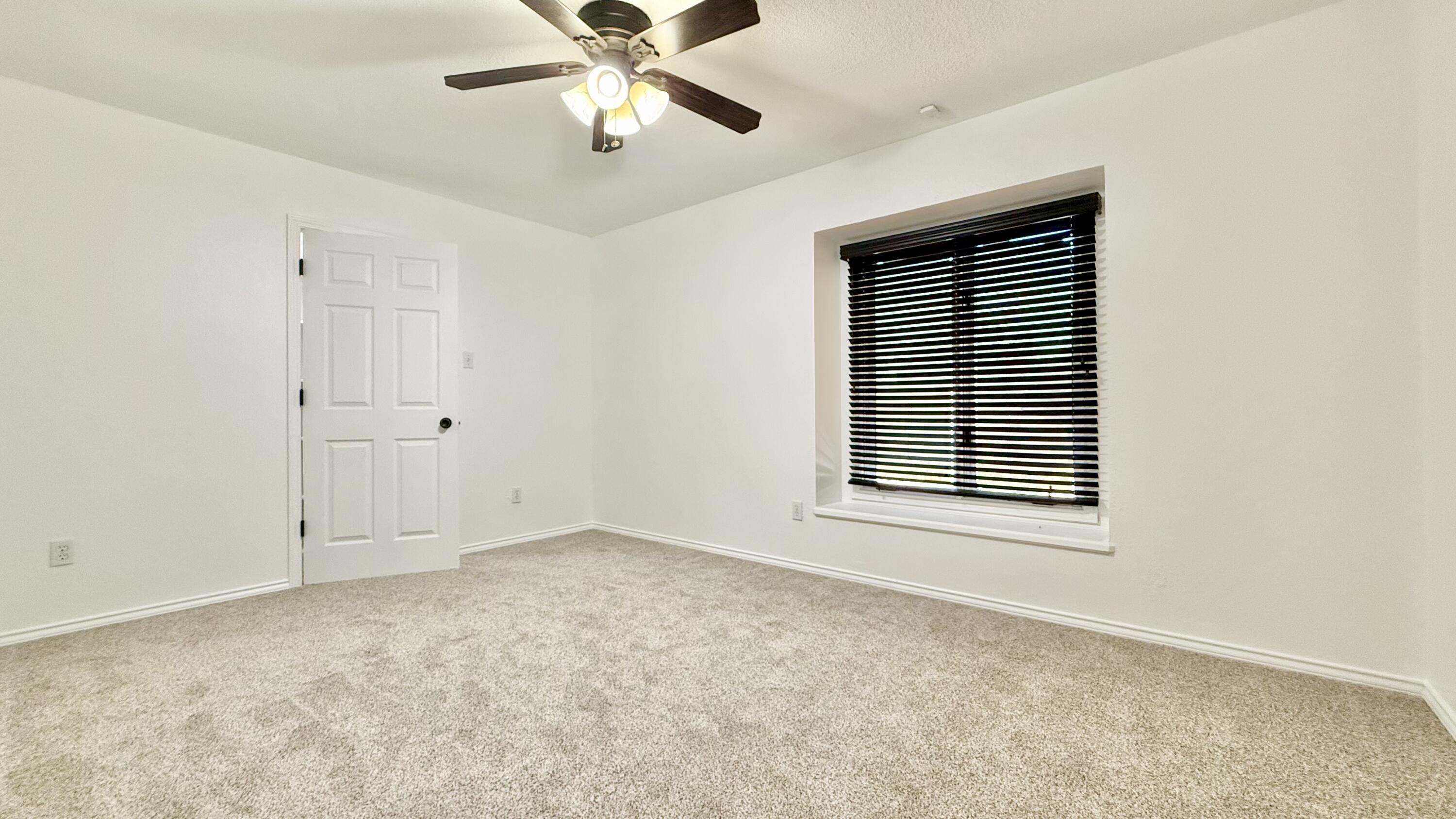 502 North Homestead Avenue Lubbock, TX 79416 - Photo 29 of 33 an empty room with windows and fan