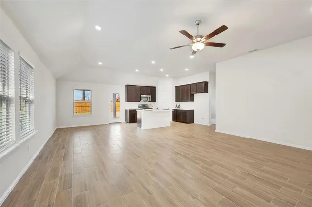 a view of kitchen with furniture and wooden floor
