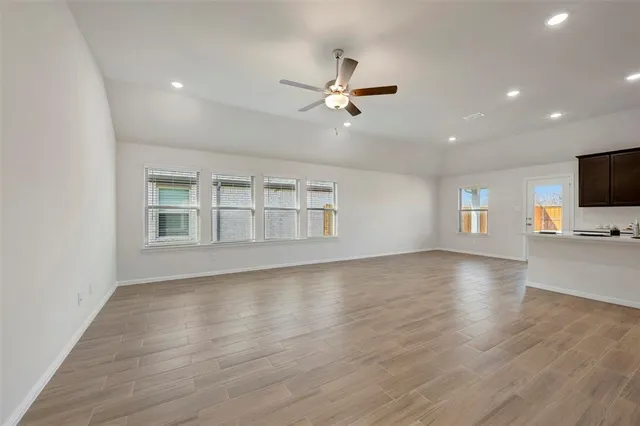 a view of livingroom with hardwood floor and a ceiling fan
