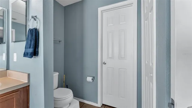 a bathroom with a toilet and a sink