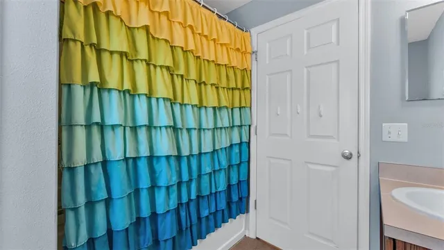 a bed room with a bed and a window