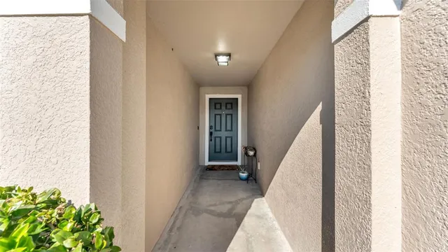 a view of a hallway with windows