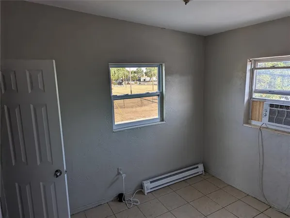 a view of an empty room with windows