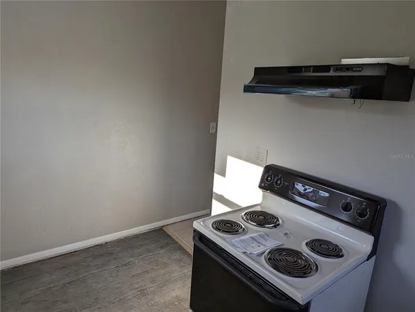 a close up of a stove top oven sitting inside of a kitchen