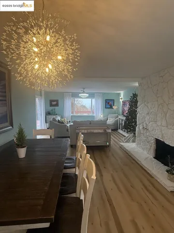 a bedroom with a bed couch and a window