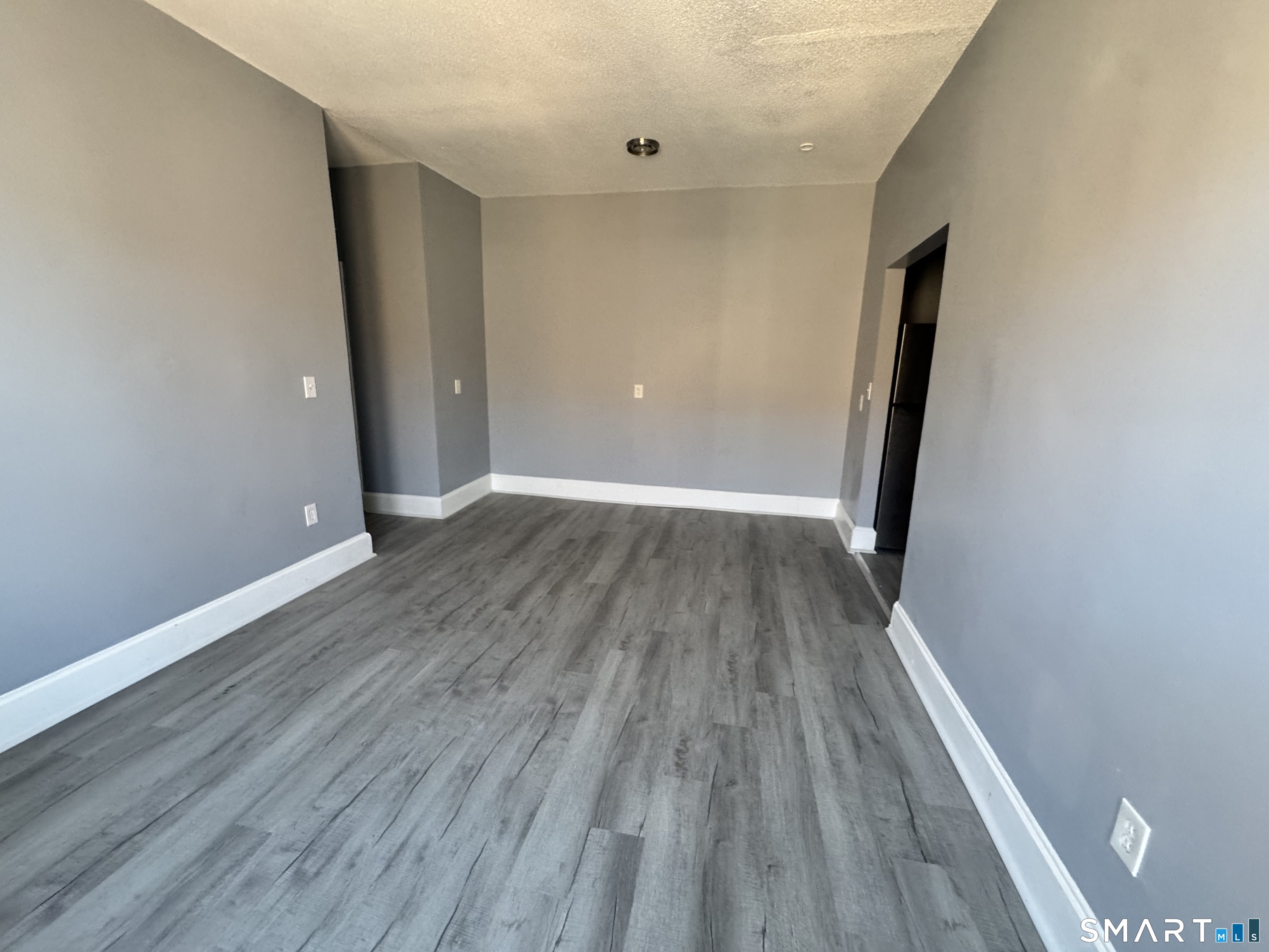 283 Wethersfield Avenue, Unit C2 Hartford, CT 06114 - Photo 3 of 7 a view of a hallway with wooden floor