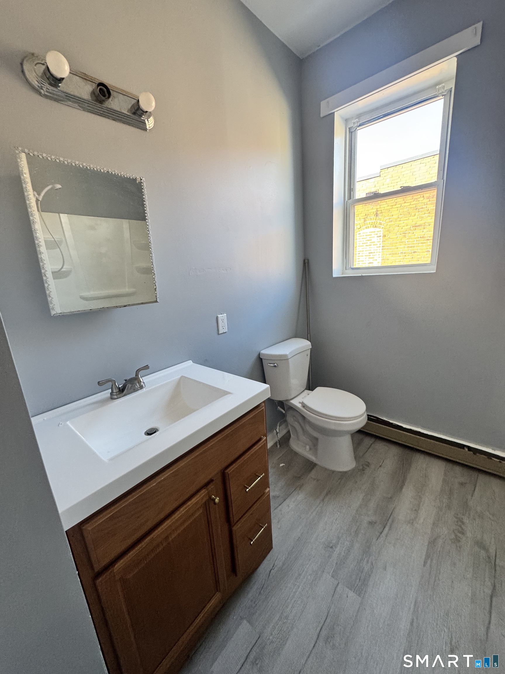 283 Wethersfield Avenue, Unit C2 Hartford, CT 06114 - Photo 7 of 7 a bathroom with a sink and a toilet
