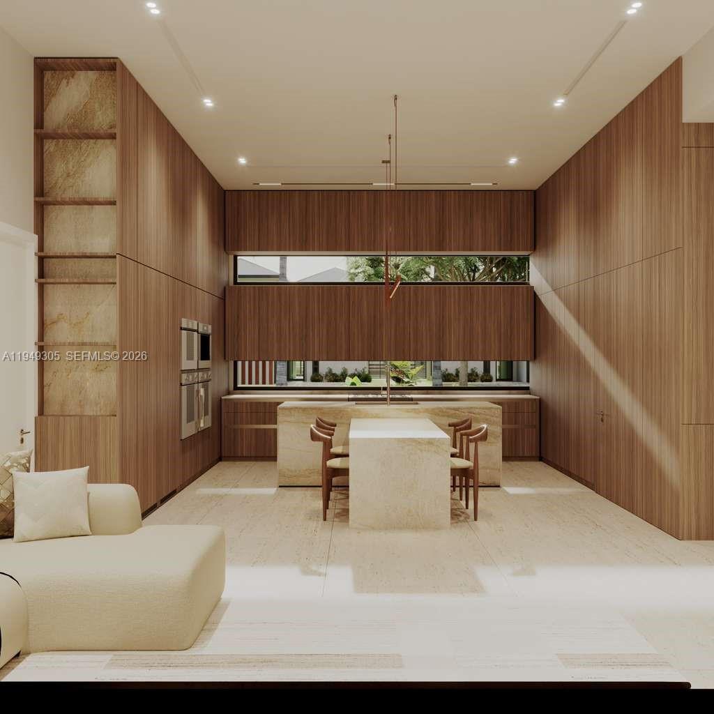 9400 Southwest 73rd Avenue Pinecrest, FL 33156 - Photo 7 of 7 a living room with kitchen island furniture and a potted plant