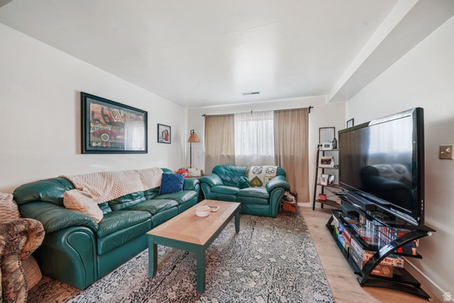 2030 Nevada Circle Provo, UT 84606 - Photo 12 of 16 Living area featuring light wood-style flooring and baseboards