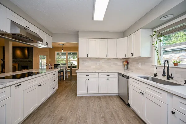 a kitchen with sink cabinets and window