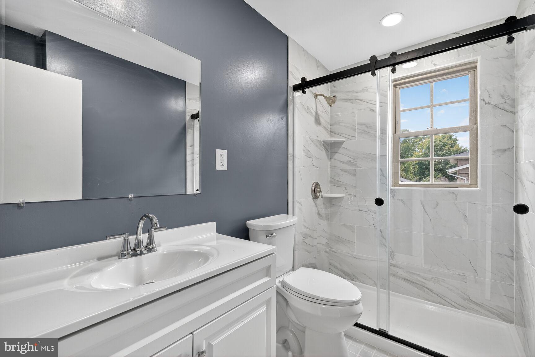 3612 Swann Road Suitland, MD 20746 - Photo 11 of 30 a bathroom with a sink toilet and shower