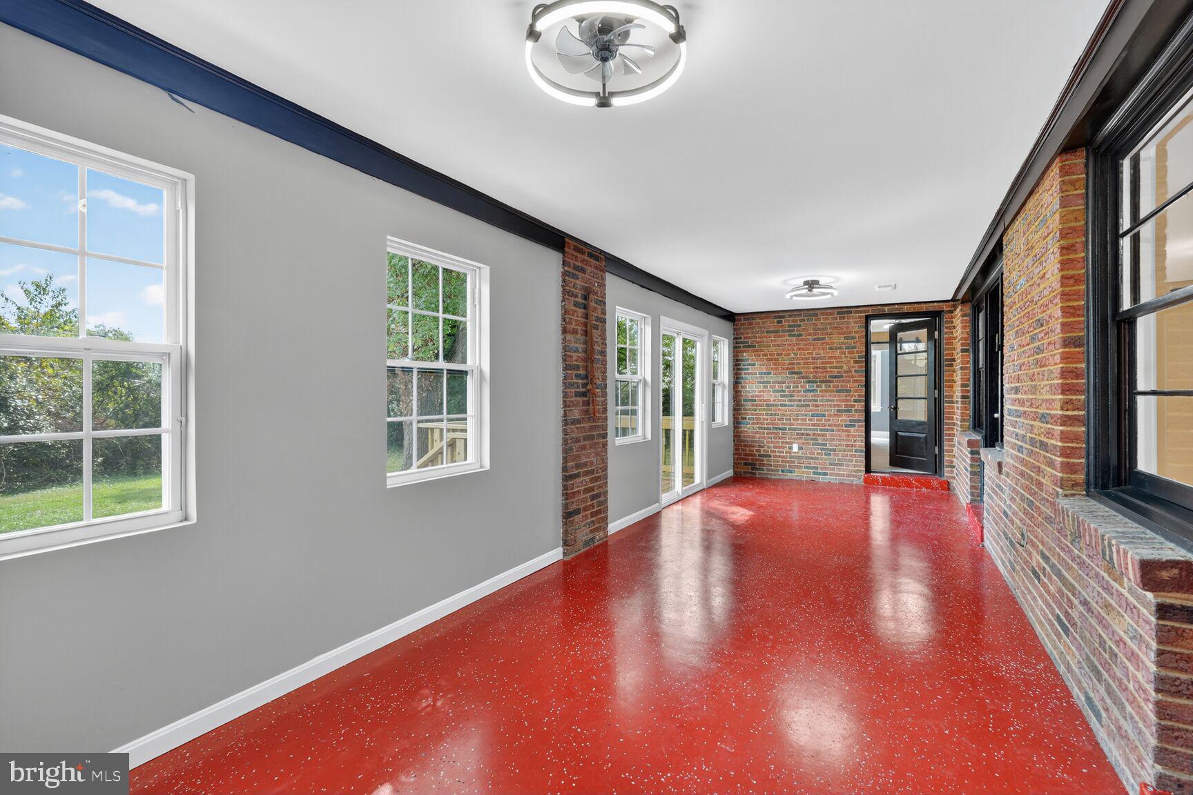 3612 Swann Road Suitland, MD 20746 - Photo 21 of 30 a view of an empty room with a window and wooden floor