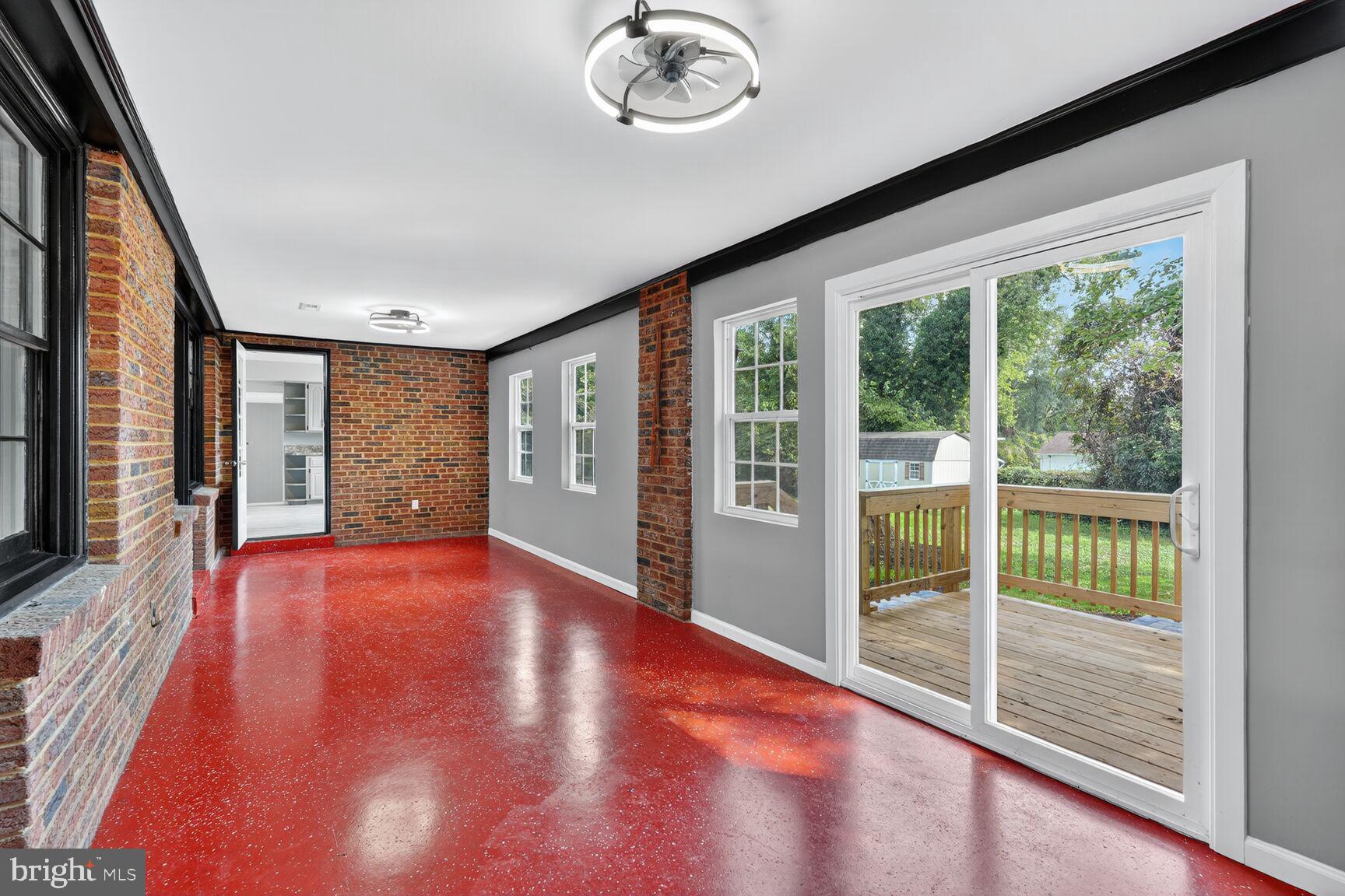3612 Swann Road Suitland, MD 20746 - Photo 22 of 30 a view of empty room with wooden floor and fan