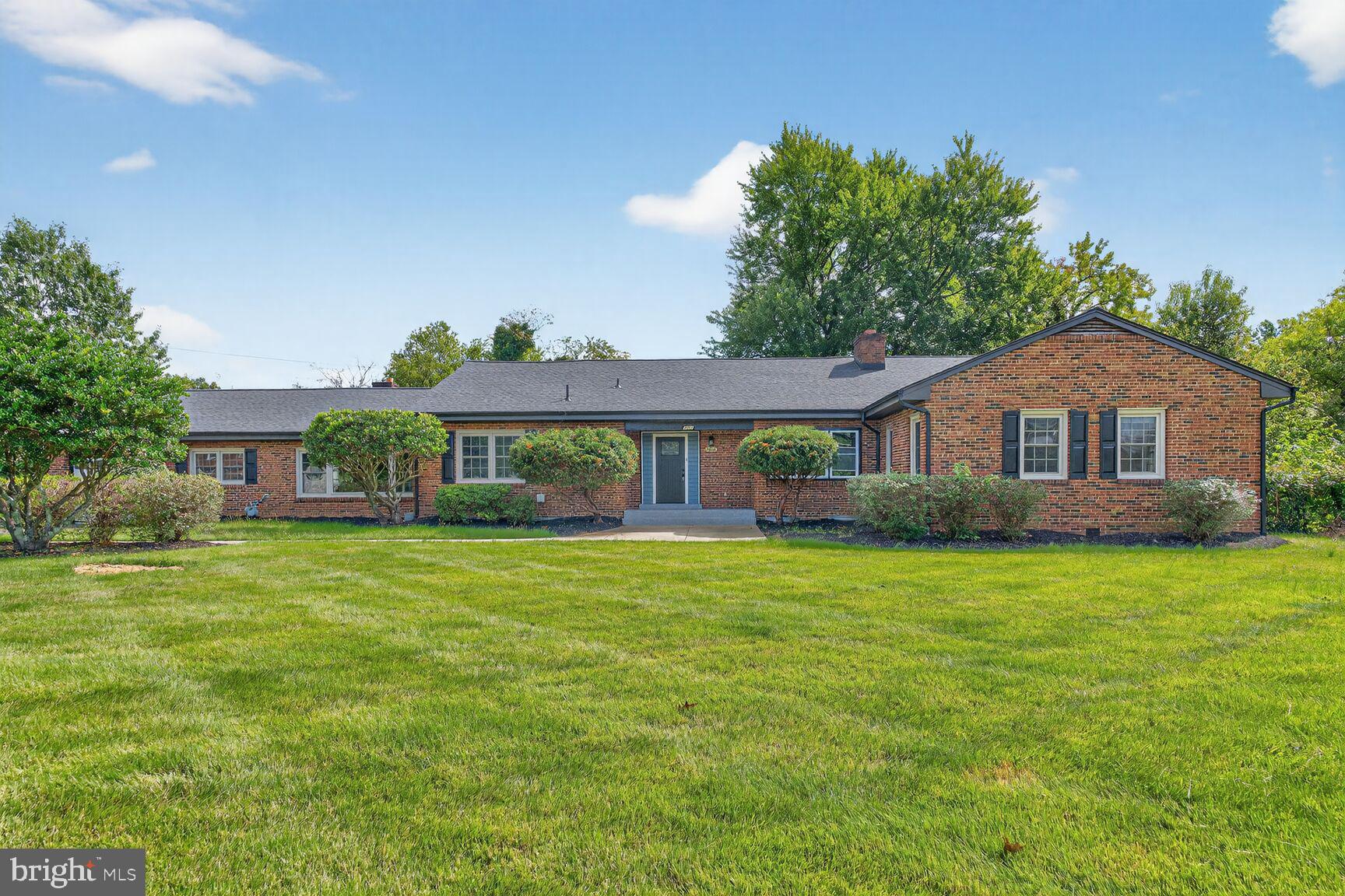 3612 Swann Road Suitland, MD 20746 - Photo 26 of 30 a front view of a house with a garden