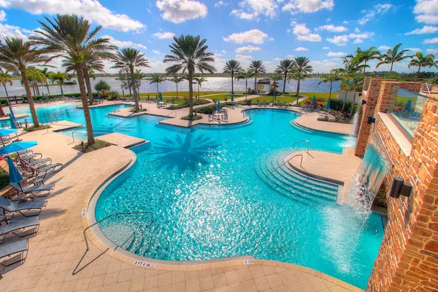 swimming pool view with a garden space