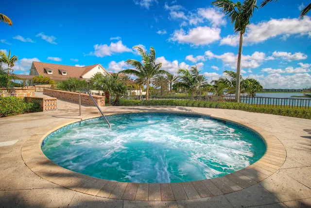 a view of a swimming pool with a patio