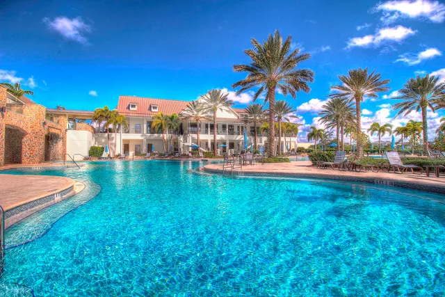 a view of a yard with a house in the background
