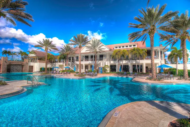 a view of an house with swimming pool garden and patio
