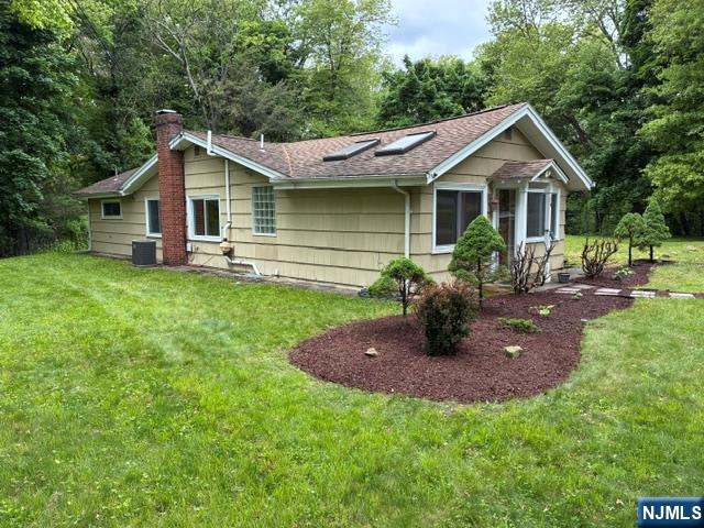 19 Crescent Road Wayne, NJ 07470 - Photo 22 of 26 a front view of house with backyard and trees