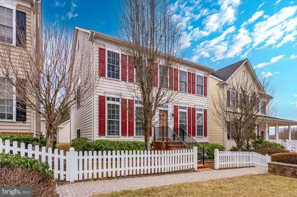 a front view of a house with a fence