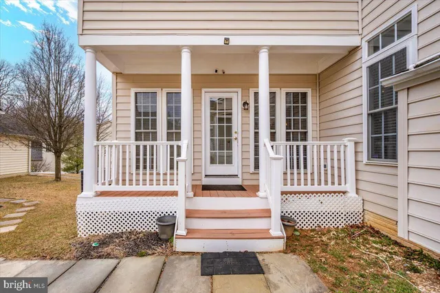 a front view of a house with a large window