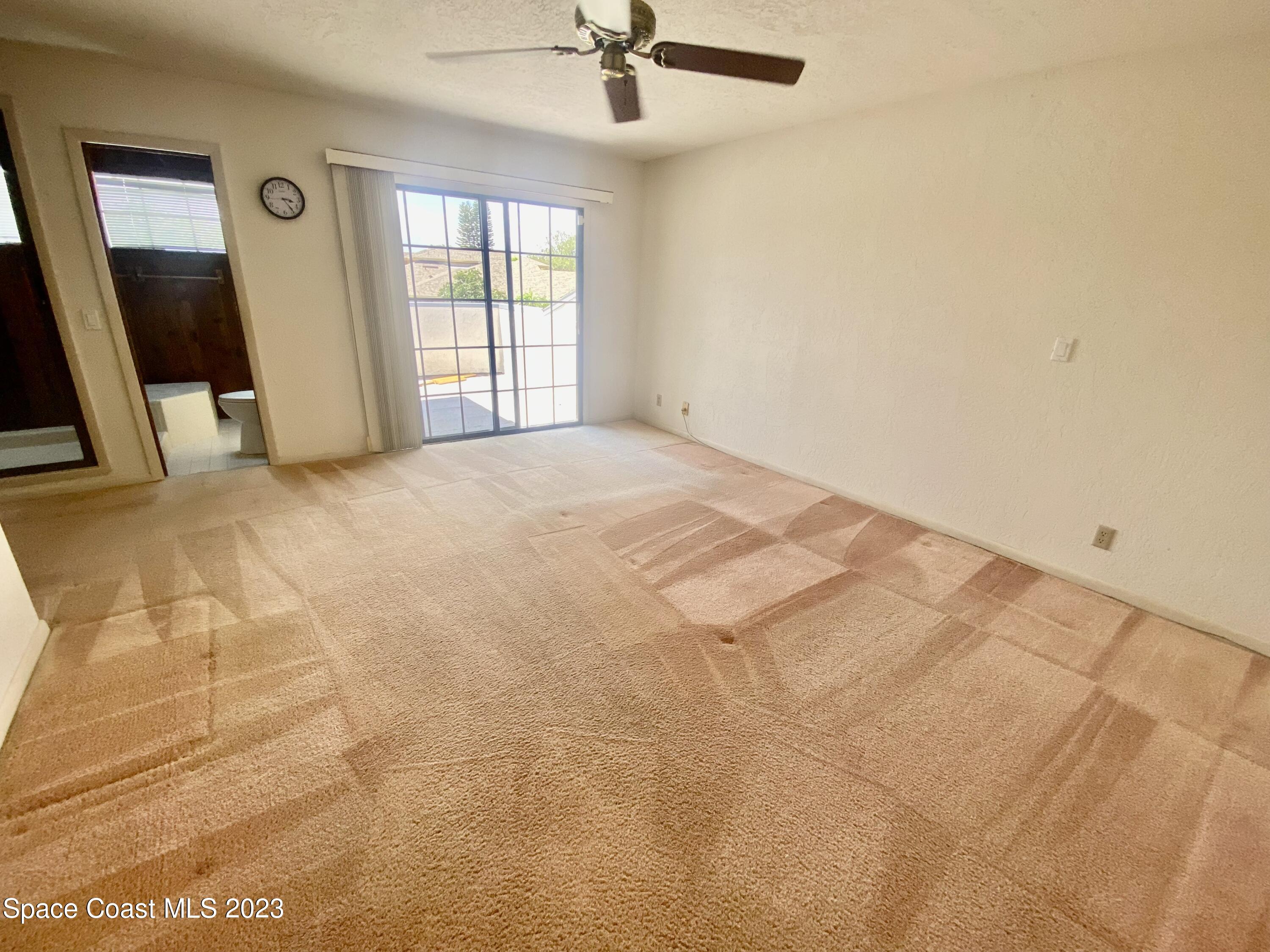 1850 Quail Trail Melbourne, FL 32935 - Photo 12 of 23 a view of an empty room with a window