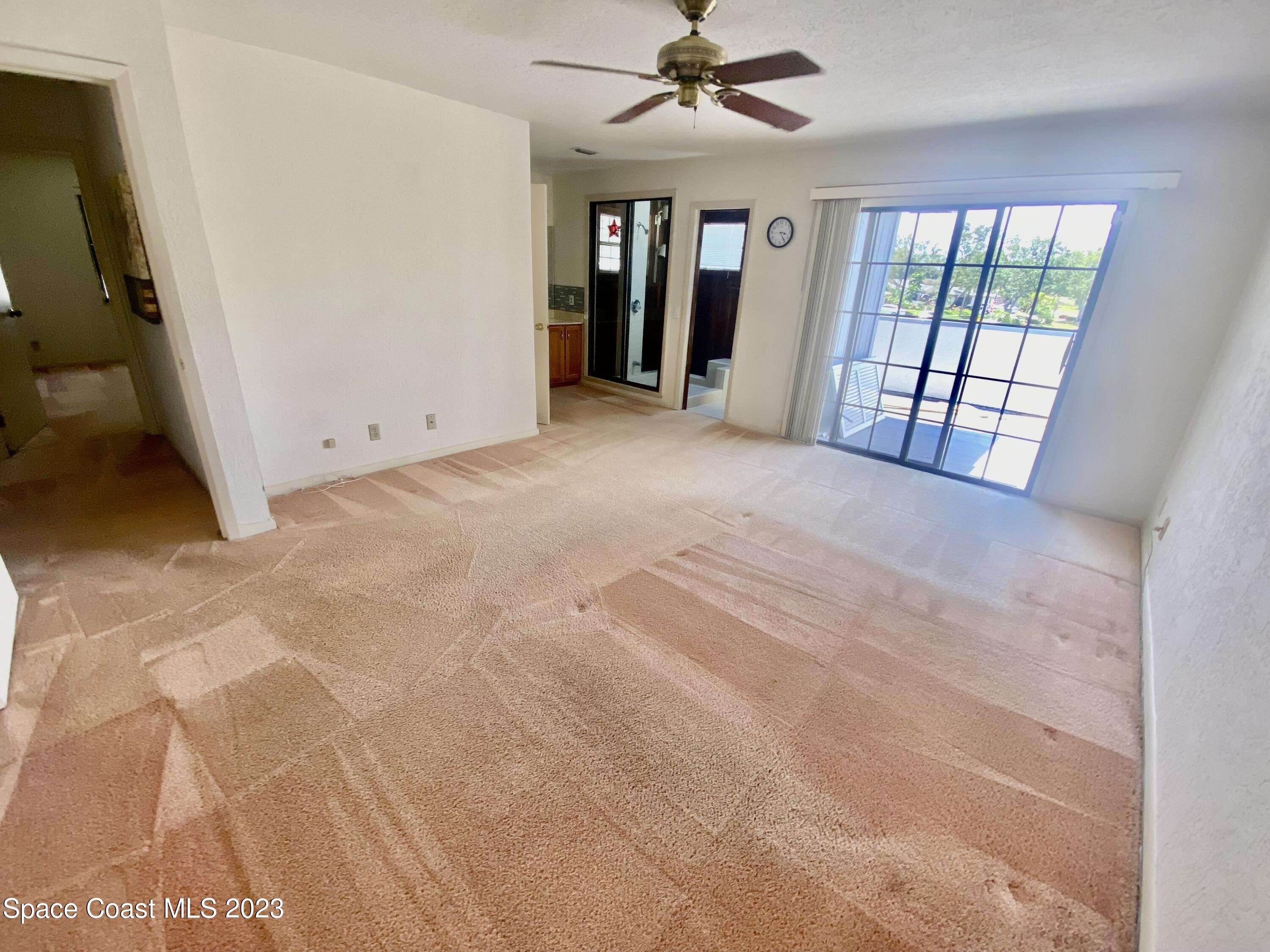 1850 Quail Trail Melbourne, FL 32935 - Photo 13 of 23 a view of an empty room with a window