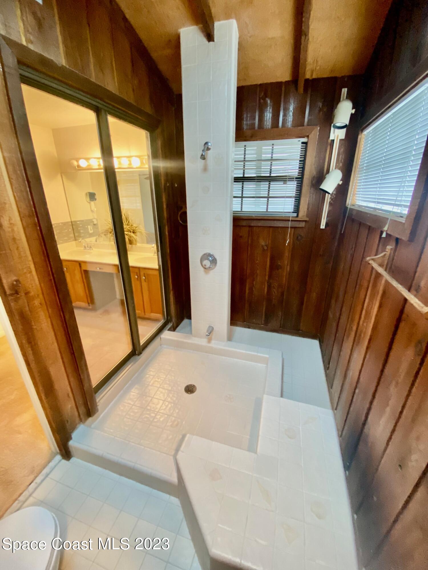 1850 Quail Trail Melbourne, FL 32935 - Photo 15 of 23 a living room with furniture and a large window