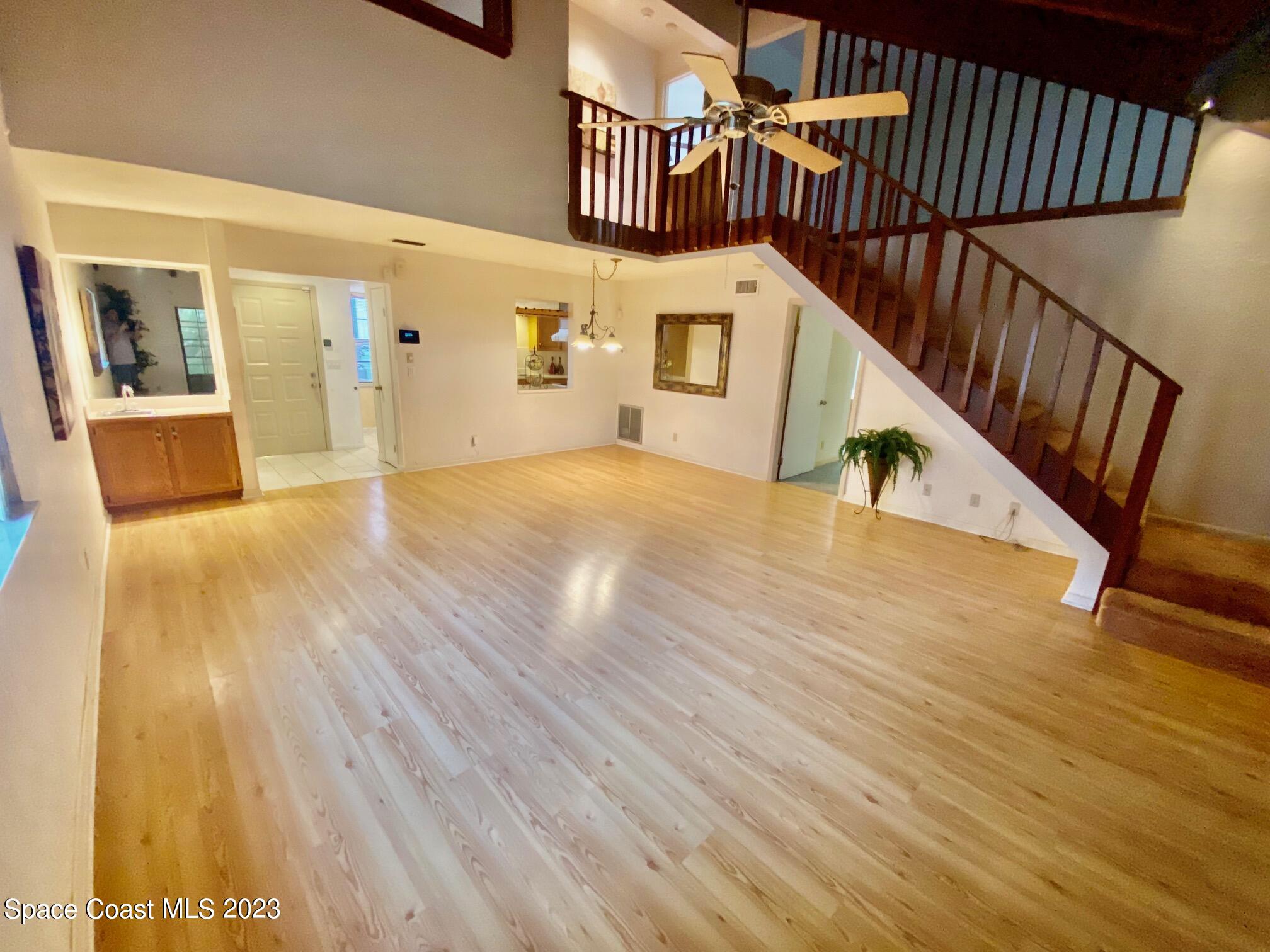 1850 Quail Trail Melbourne, FL 32935 - Photo 5 of 23 a view of an entryway with wooden floor