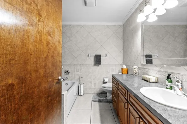 a bedroom with bed and wooden floor