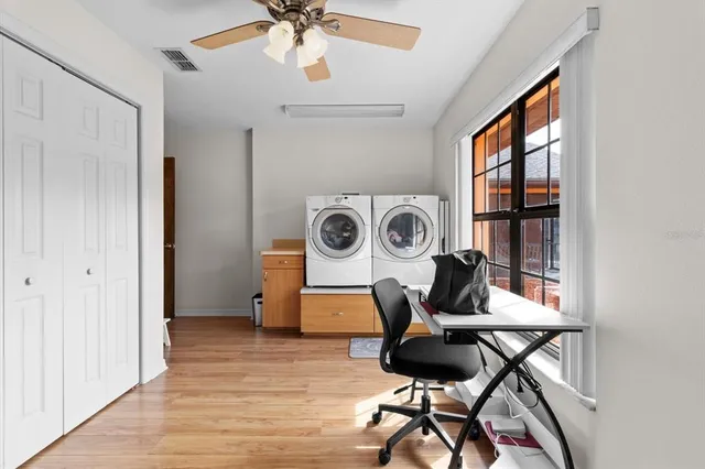 a spacious bedroom with a bed and a large window