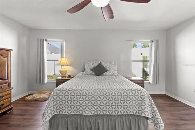 a bedroom with a bed and a book shelf