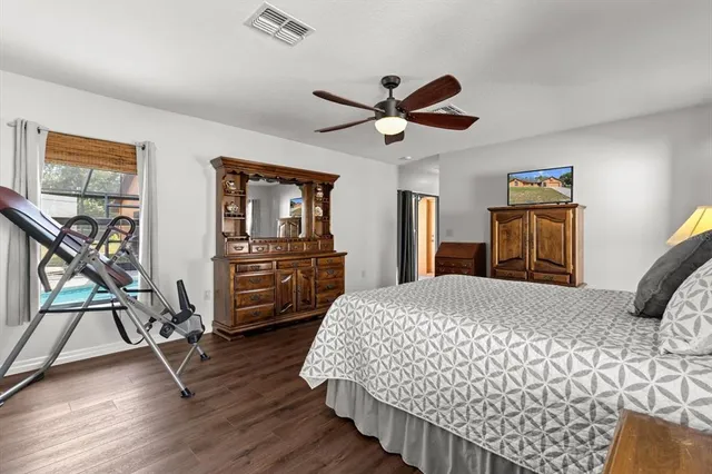 a kitchen with stainless steel appliances granite countertop a kitchen island a stove a table and chairs