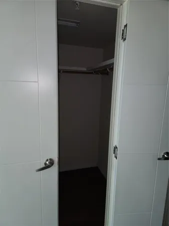 a bathroom with a sink a mirror and a shower