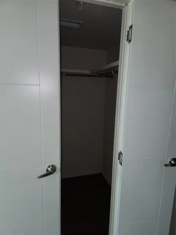 a bathroom with a sink a mirror and a shower