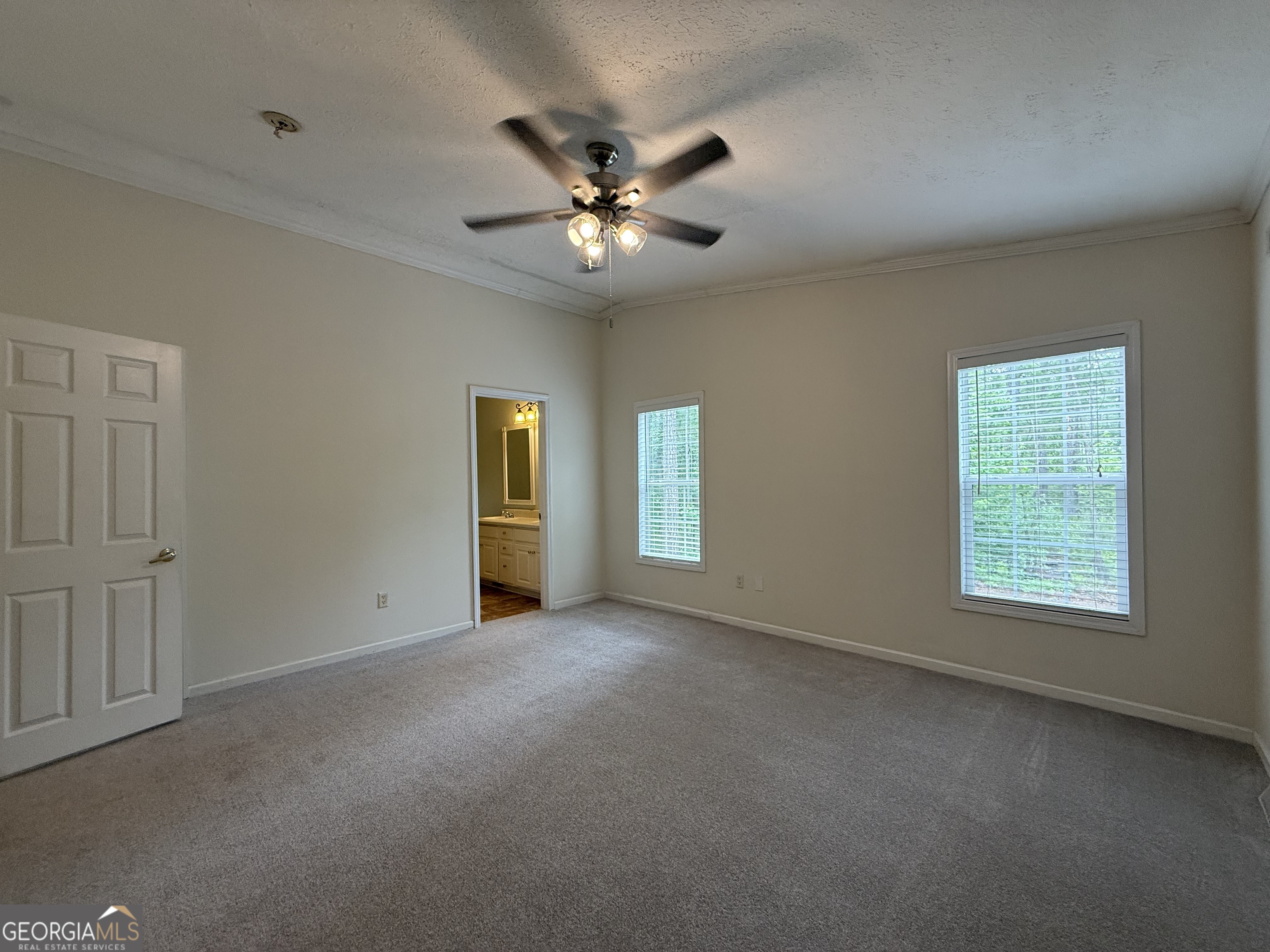 1081 Marshall Church Road Thomson, GA 30824 - Photo 17 of 26 an empty room with closet and windows